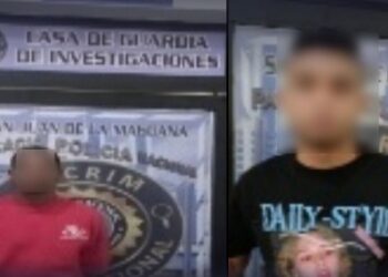 Policía apresa a dos hombres por asalto a mano armada